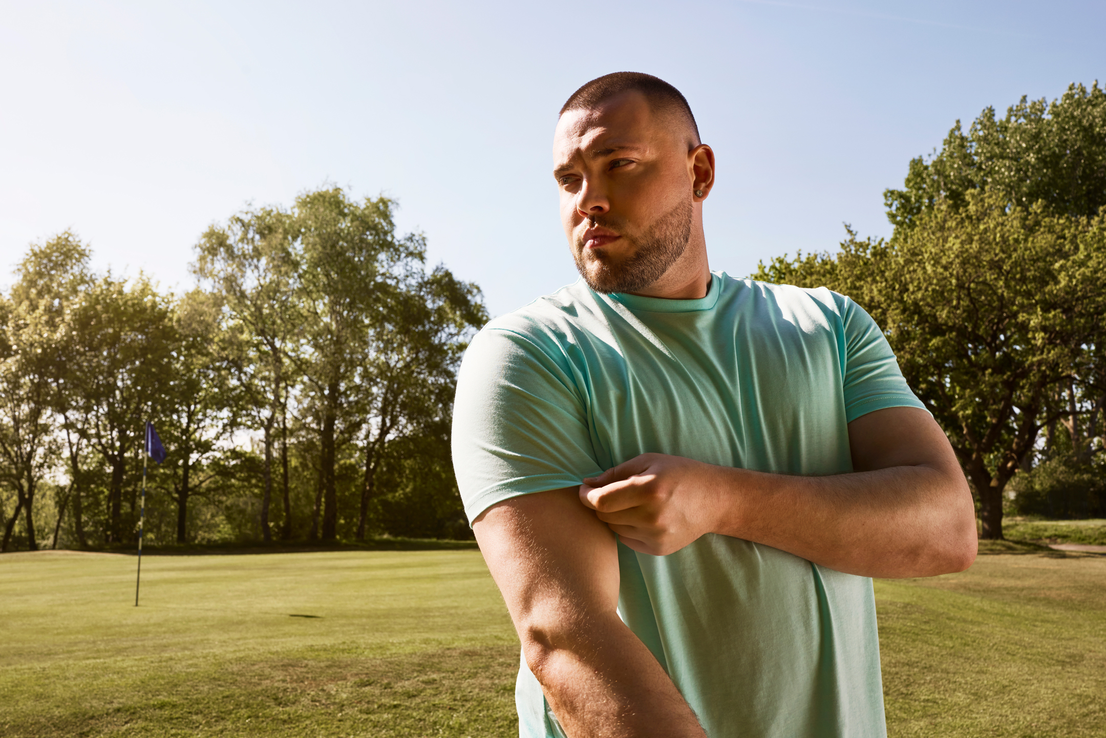 Plus sized man on golf course