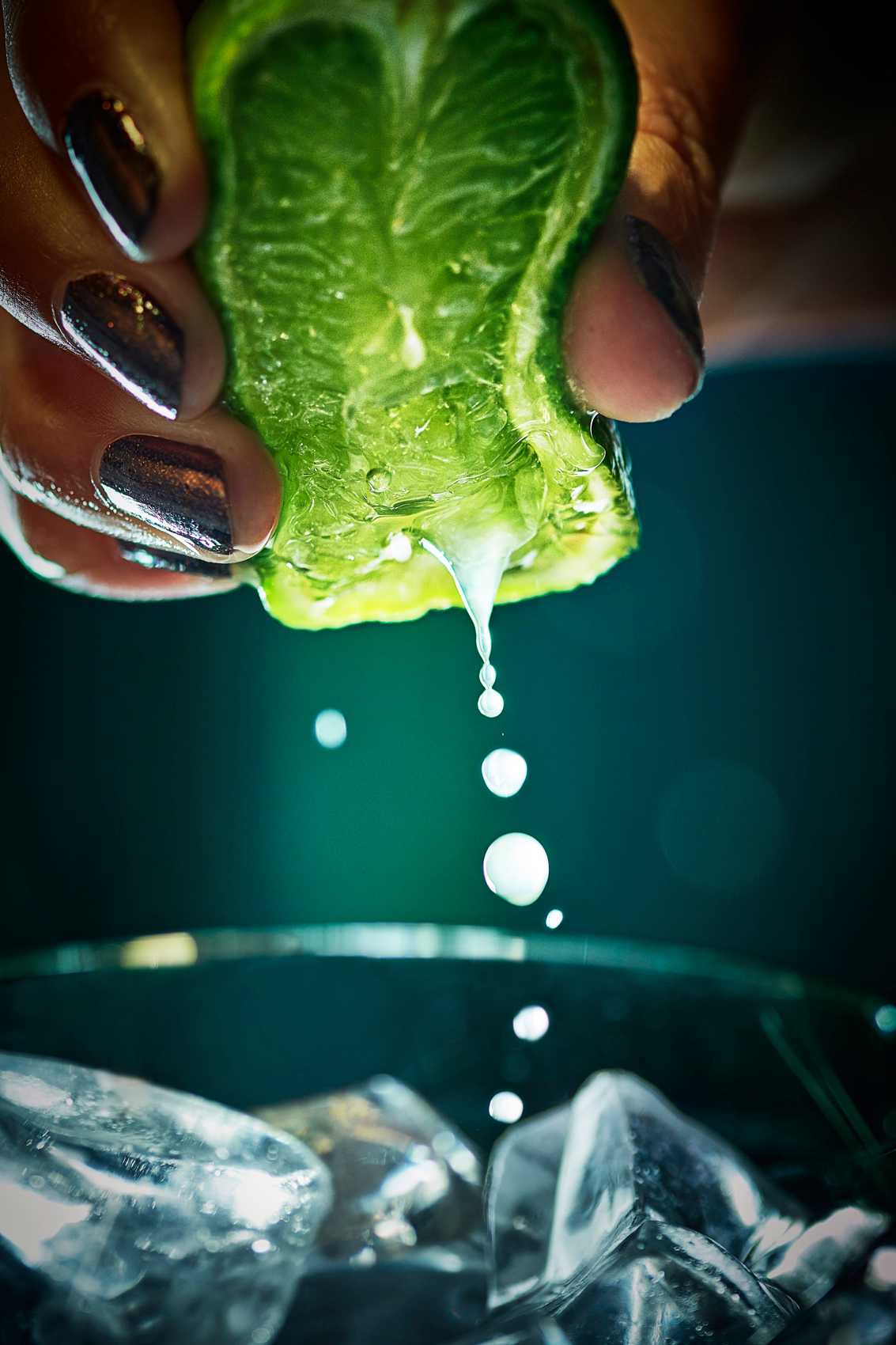 Fresh lime squeezed over ice